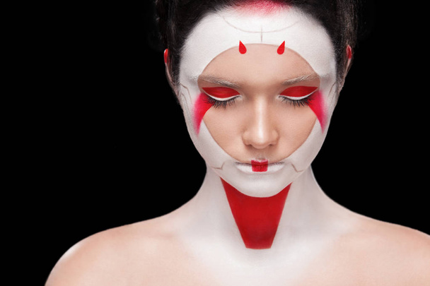 Face Painting in Japan style. Body art colorful make-up. Geisha isolated on black background. - Foto, Imagem
