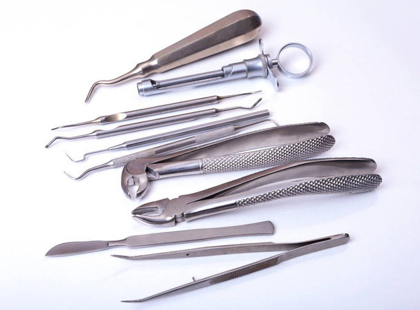 Set of metal medical equipment tools for teeth dental care isolated on white background. - Photo, Image