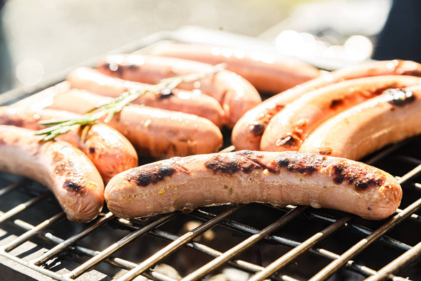 Sausages on the grill background - Photo, Image