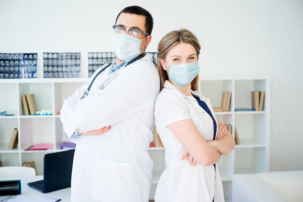 Portrait of two doctors in masks - Фото, зображення