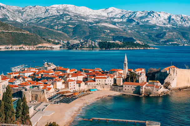The Old Town of Budva, mountains covered with snow - Photo, Image