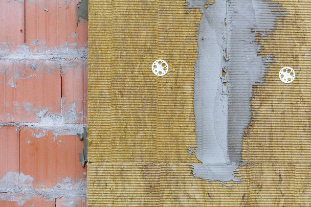 Wall of bricks and insulation wool. - Photo, Image
