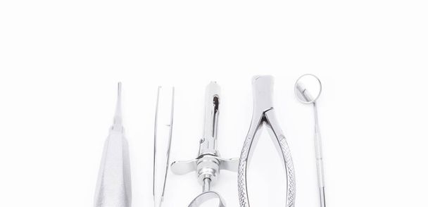 Dental tools and equipment on white background. - Foto, afbeelding
