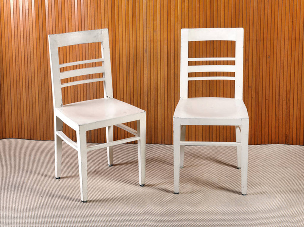 Two plain white painted wooden kitchen chairs - Zdjęcie, obraz
