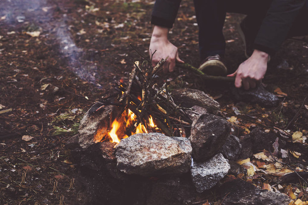 Campfire in the forest. man's hands - Photo, Image
