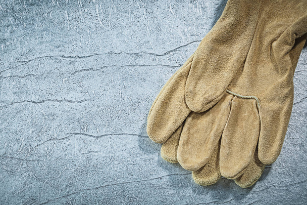 Leather safety gloves on metallic background construction concep - Photo, image