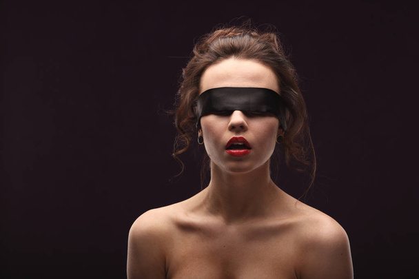 Beautiful brunette Woman with Black Lace mask over her Eyes. Red Sexy Lips. Open Mouth. concept passion - Foto, imagen