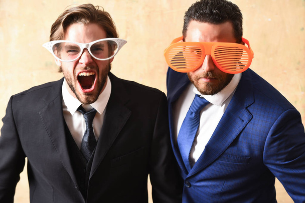 Office party concept. handsome bearded businessmen with funny glasses - Фото, зображення