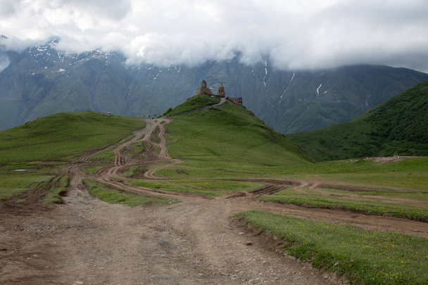 Church in Caucasus mountains in Kazbegi, Georgia - Photo, Image