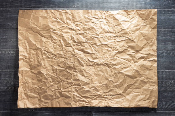 sheet of paper at wooden background - Foto, Imagem