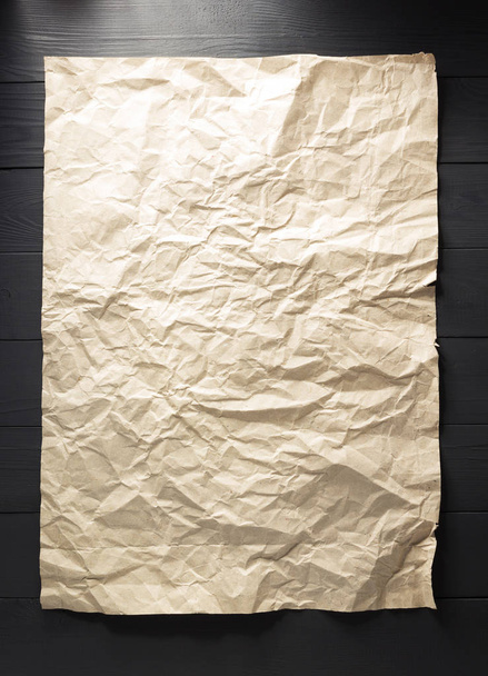 crumpled paper at wood - Foto, Imagen
