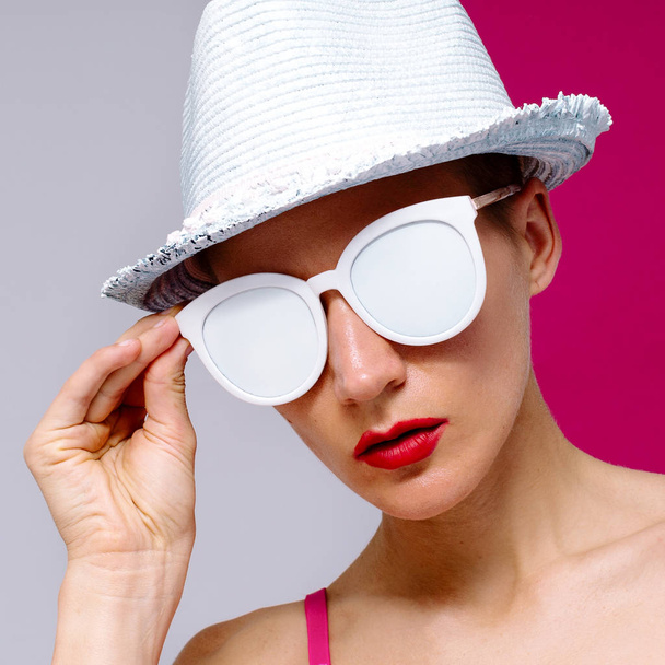 Model Pop Art style in sunglasses and a hat. Beach Minimal - Zdjęcie, obraz