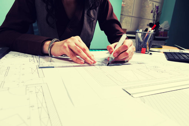 Hands of architect woman working on blueprints - Zdjęcie, obraz