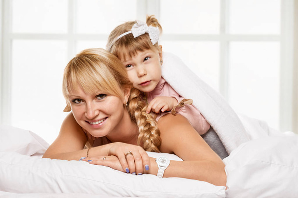 cheerful family. Mother and little daughter portrait - Photo, Image