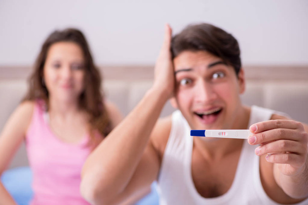 Happy couple finding out about pregnancy test results - Photo, Image