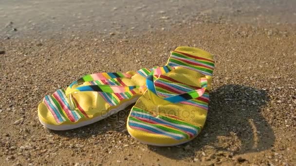 Flip flops on sand background. - Footage, Video