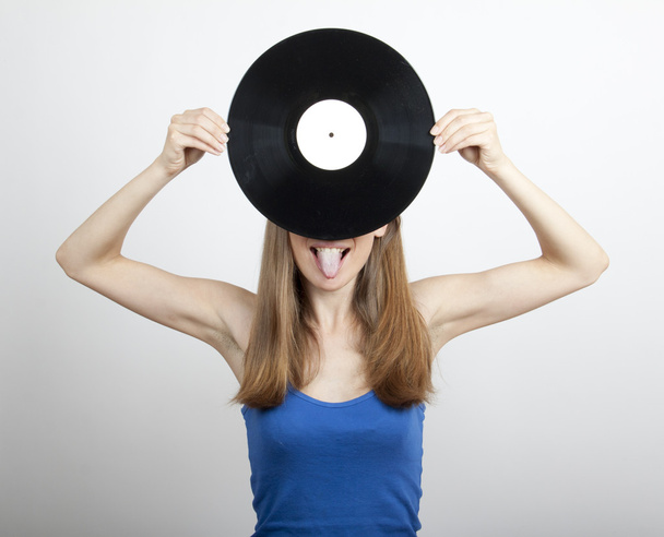 Girl with vinyl disc, isolated on white - Фото, изображение