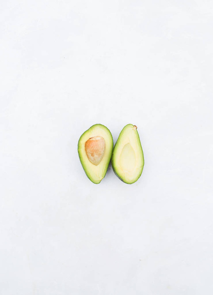 halves of avocado on white - Photo, Image
