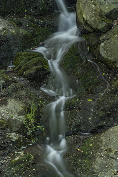 Waterfall near Moravany village in spring evening - Фото, изображение