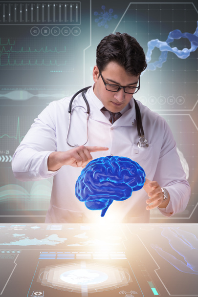 Männlicher Arzt mit Gehirn in medizinischem Konzept - Foto, Bild
