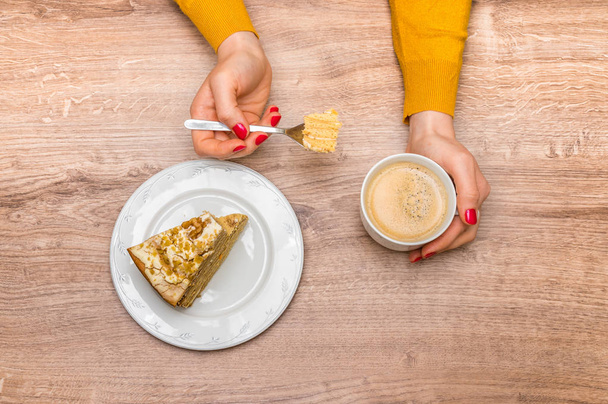 Woman having sweet cake and hot coffee at home - Foto, imagen