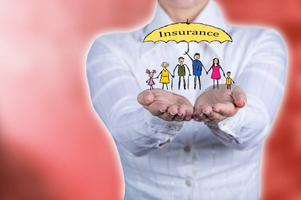 Propriety insurance concept ,Woman holding hands with a drawn family symbol - Photo, Image