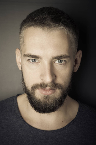 Portrait of a young man with a beard. Toned - Foto, afbeelding