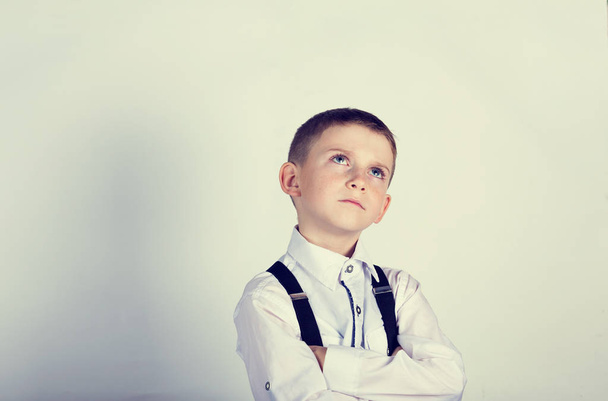 Portrait of a little boy thinking deeply about something - Foto, imagen