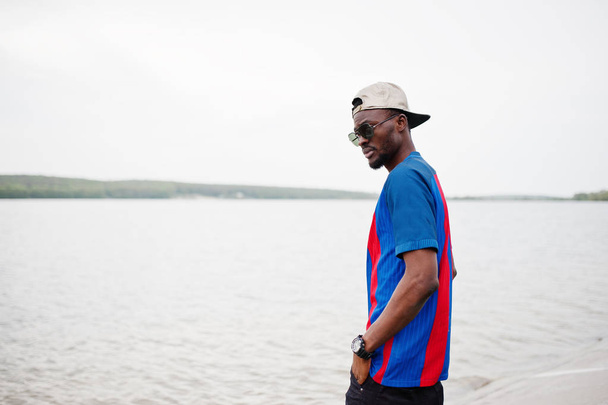 Stylish african american boy wear at cap, football t-shirt and s - Fotografie, Obrázek