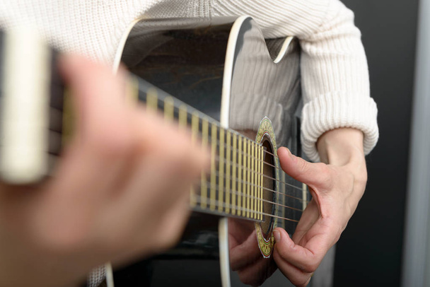 Woman's hands playing acoustic guitar, close up - Photo, Image