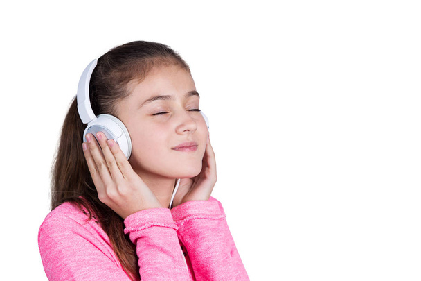 Little girl enjoying music in headphones  - Photo, image