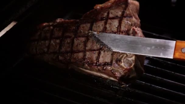 Video of cooking steak on the grill in real slow motion - Footage, Video