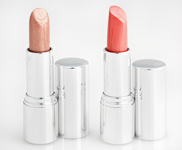 Two brown lipsticks isolated over white - Foto, Imagem