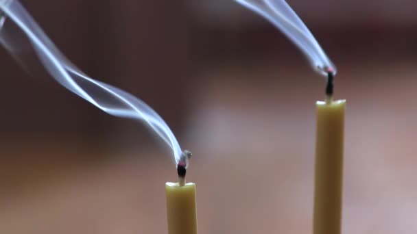 Thick White Smoke Billowing Out Of Two Beeswax Yellow Candles - Footage, Video