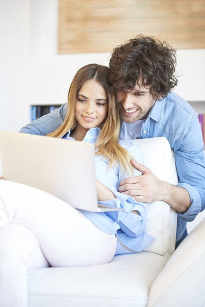 couple with laptop at home - Photo, image