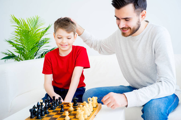 Father and son playing chess - Photo, image