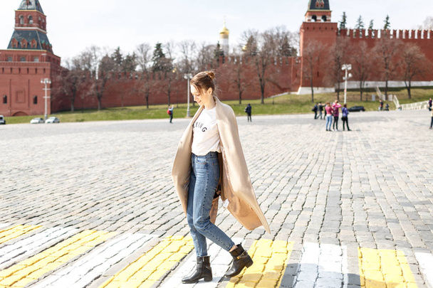 young woman is walking in the city of Moscow on the Red Square - Fotó, kép