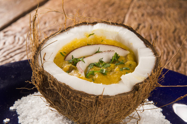 Sururu soup inside a coconut. Brazilian dish. - Фото, изображение