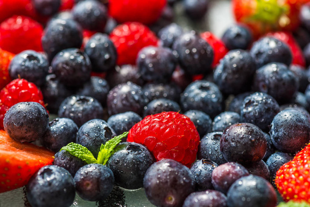 Variety of Fresh Berries such as Blueberries, Raspberries and St - Foto, afbeelding