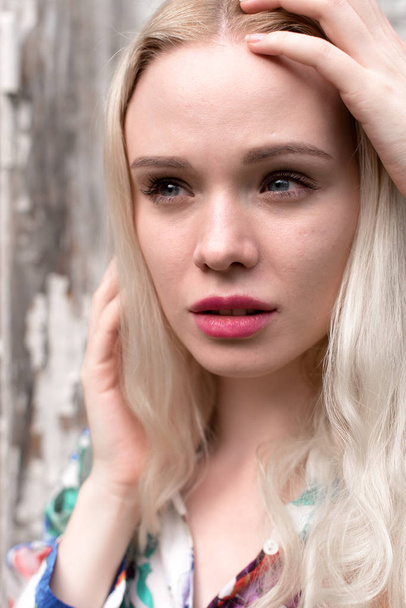 Young european blond woman outdoors portrait. Bright white colors. - Foto, immagini