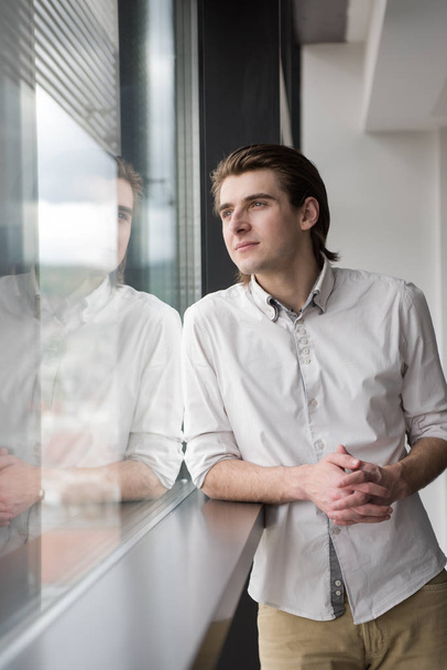 young businessman in startup office by the window - Zdjęcie, obraz