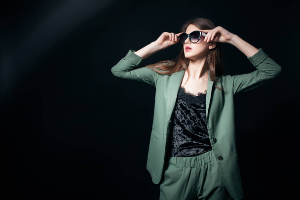 fashion business lady in sunglasses posing in studio; - Photo, image