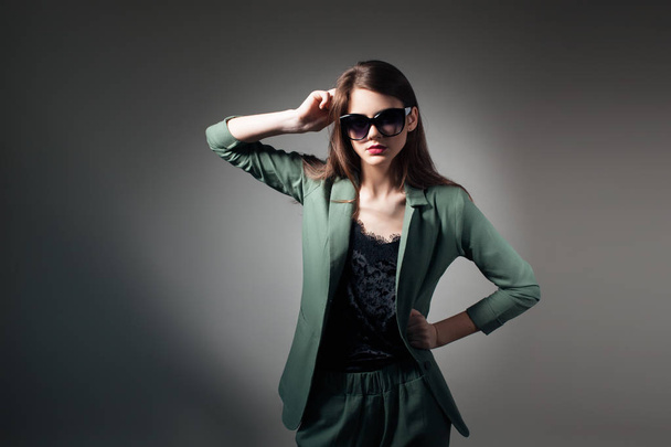 fashion business lady in sunglasses posing in studio; - Valokuva, kuva
