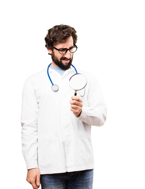 young doctor man with a magnifying glass - Foto, Imagem