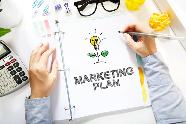 Person drawing Marketing Plan concept  - Фото, зображення