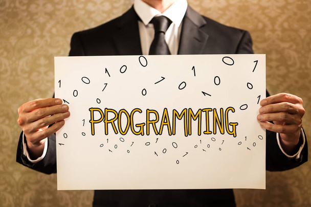 Programming text with businessman - Foto, imagen
