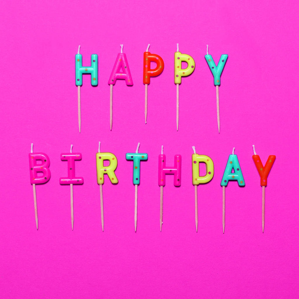 Happy Birthday flat lay party decorations on pink background - Fotó, kép