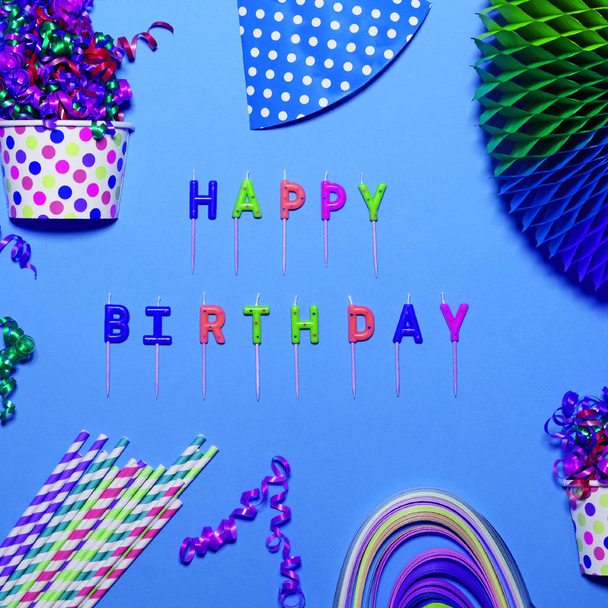 Happy Birthday flat lay with party decorations on blue backgroun - Foto, Imagen