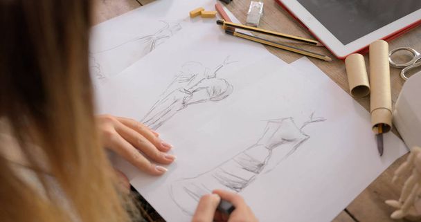 Crop shot of dressmaker drawing sketches - Photo, Image