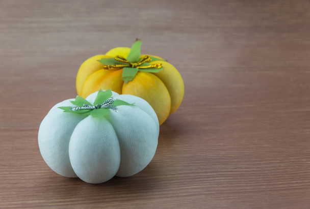 Small pumpkin statue on wood background - Photo, Image